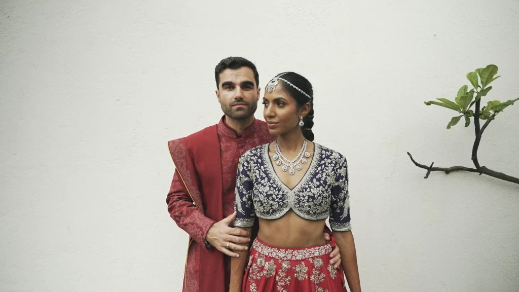 Bride and groom in traditional red Sri Lankan wedding attire