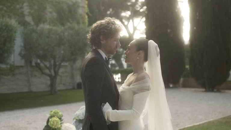 Bride and groom backlit in a garden during their wedding